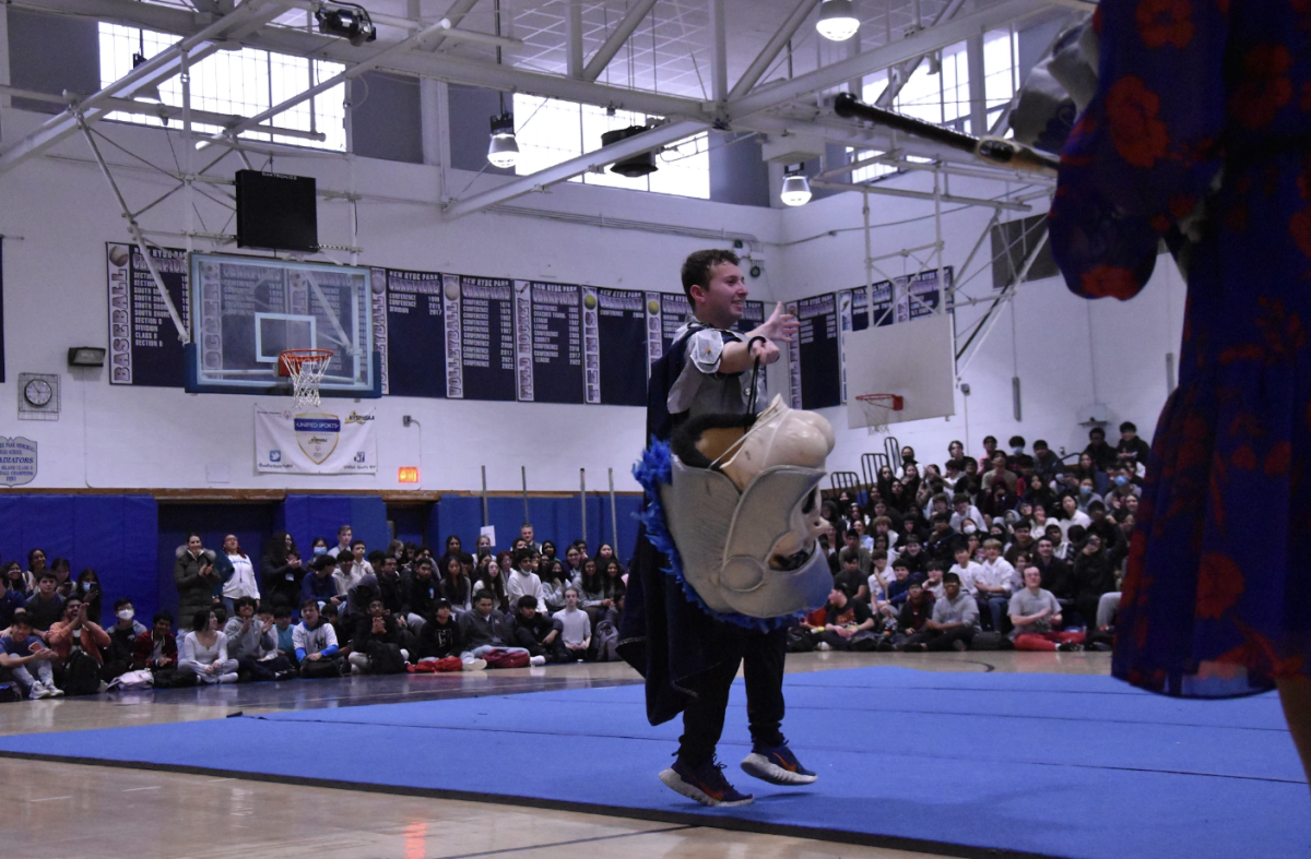 Matthew Zatz' grand reveal permitted him to take off the stuffy Gladiator head during winter pep rally.